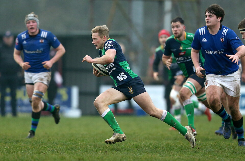 Conor McAuley's shirt displays the initials last season as Hinch play QUB.